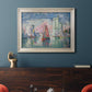 Impressionist harbor scene by Paul Signac in an ornate champagne frame displayed in a dark-toned interior setting.