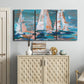 Three-panel canvas wall art featuring graphic pop style sailboats, displayed above a cabinet in an entryway.