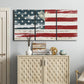 Three-panel canvas wall art featuring rustic american flag country style, displayed above a cabinet in an entryway.