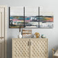 Three-panel canvas wall art featuring cheerful abstract coastal seascape, displayed above a cabinet in an entryway.