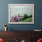 Impressionist coastal villas landscape by Gustave Caillebotte in an ornate weathered white frame displayed in a dark-toned interior setting.