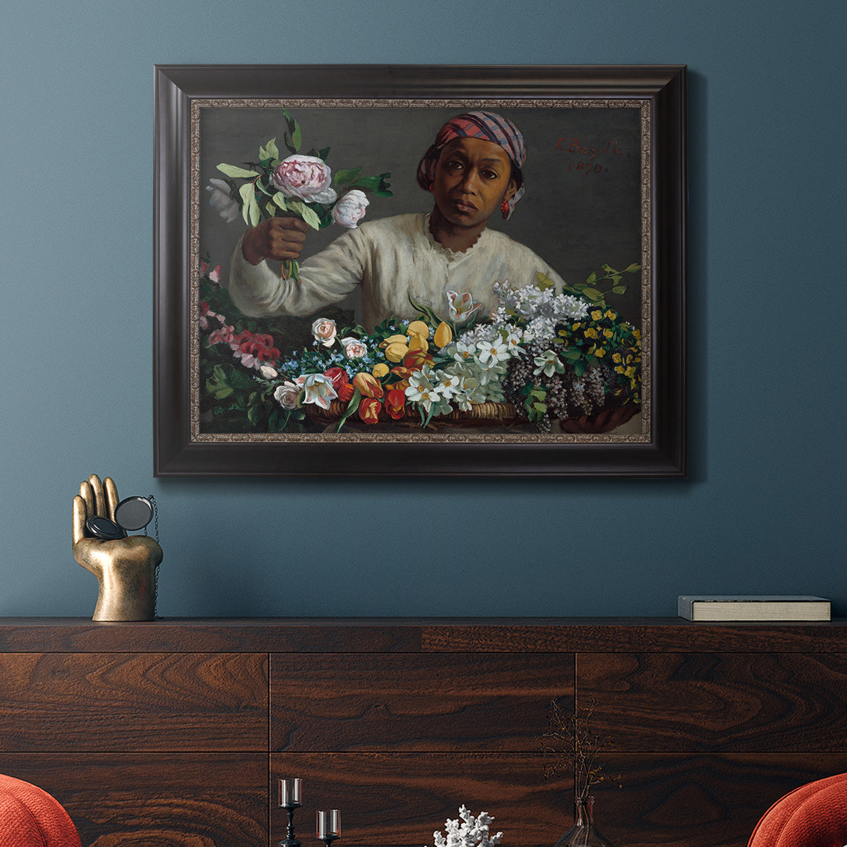 Traditional portrait of a woman holding peonies by Frédéric Bazille in an ornate black frame with gilded inner detail displayed in a dark-toned interior setting.