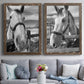 Set of two walnut barnwood framed canvas prints depicting paired modern equestrian photography with bridled faces, wooden rails, and softly blurred farm backgrounds above a sofa in a contemporary living room.