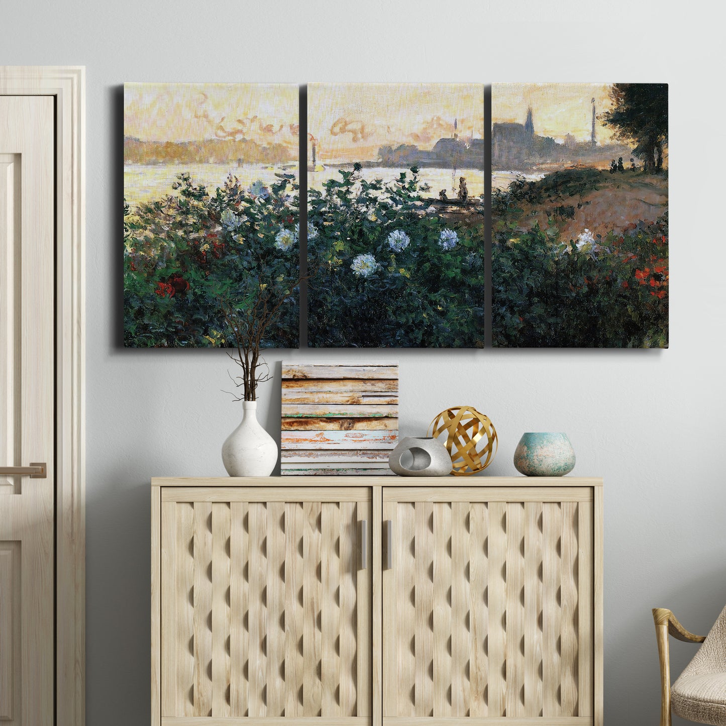 Three-panel canvas wall art featuring formal garden near museum grounds, displayed above a cabinet in an entryway.