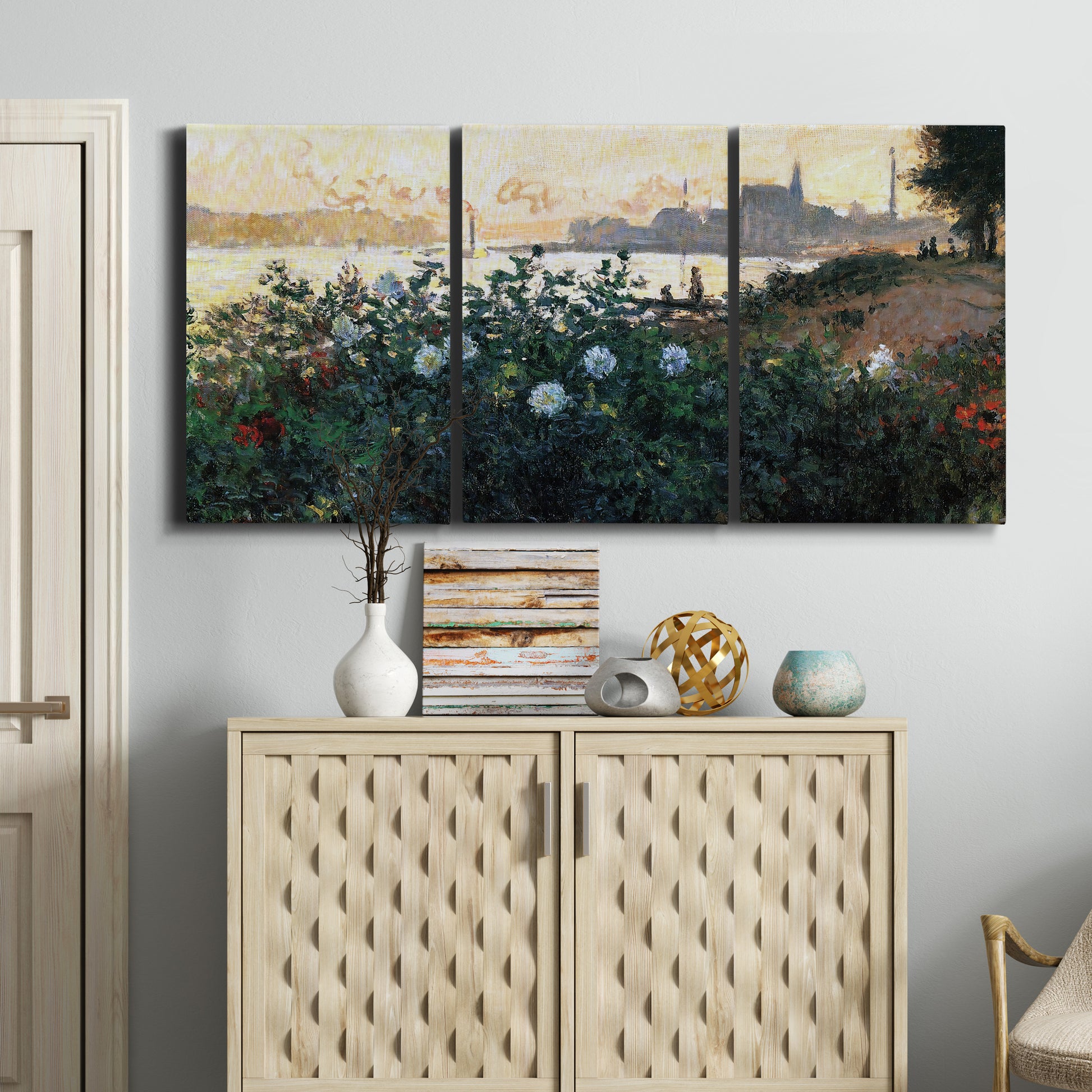 Three-panel canvas wall art featuring formal garden near museum grounds, displayed above a cabinet in an entryway.