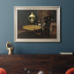 Impressionist domestic interior scene by Claude Monet in an ornate champagne frame displayed in a dark-toned interior setting.