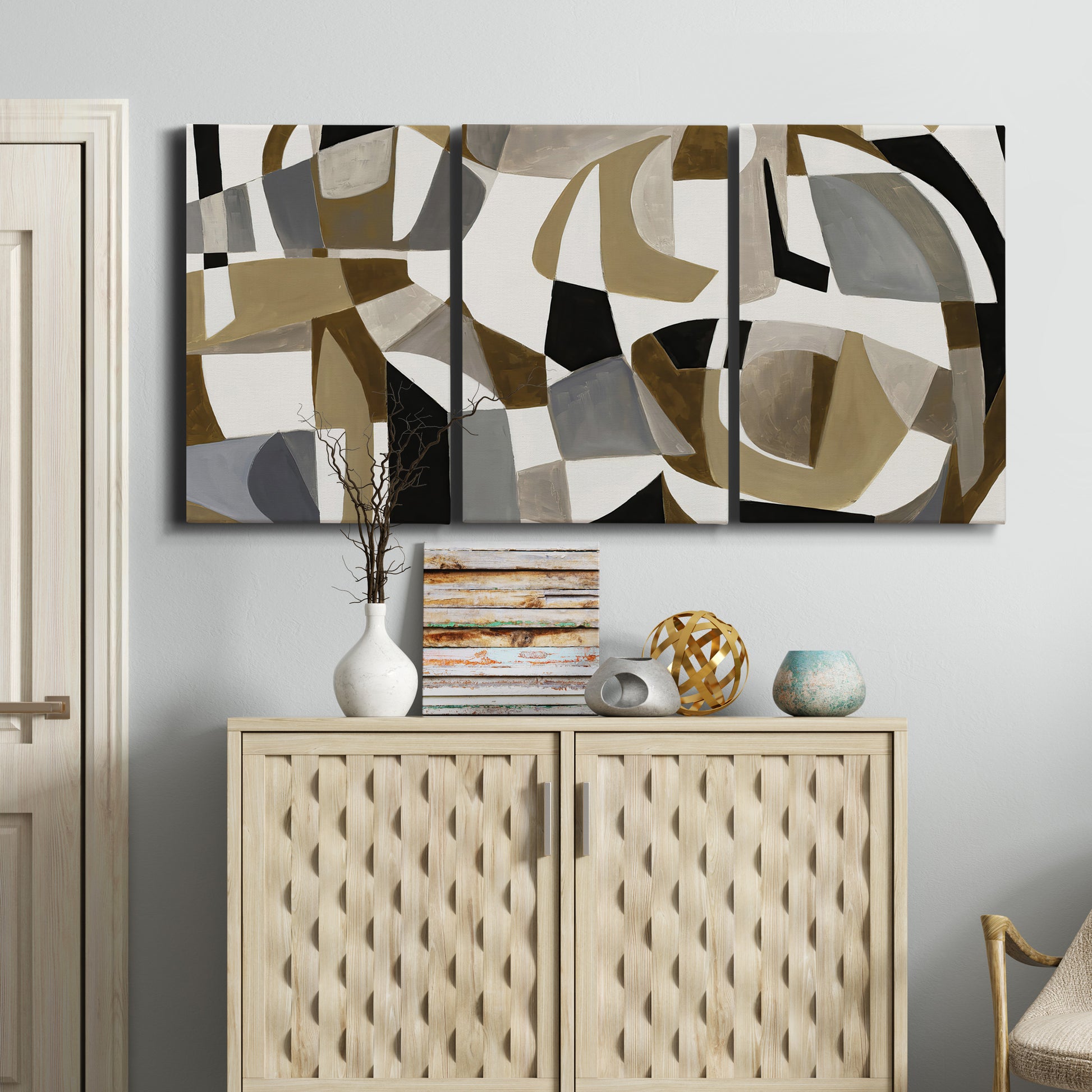 Three-panel canvas wall art featuring overlapping mid century geometric shapes, displayed above a cabinet in an entryway.