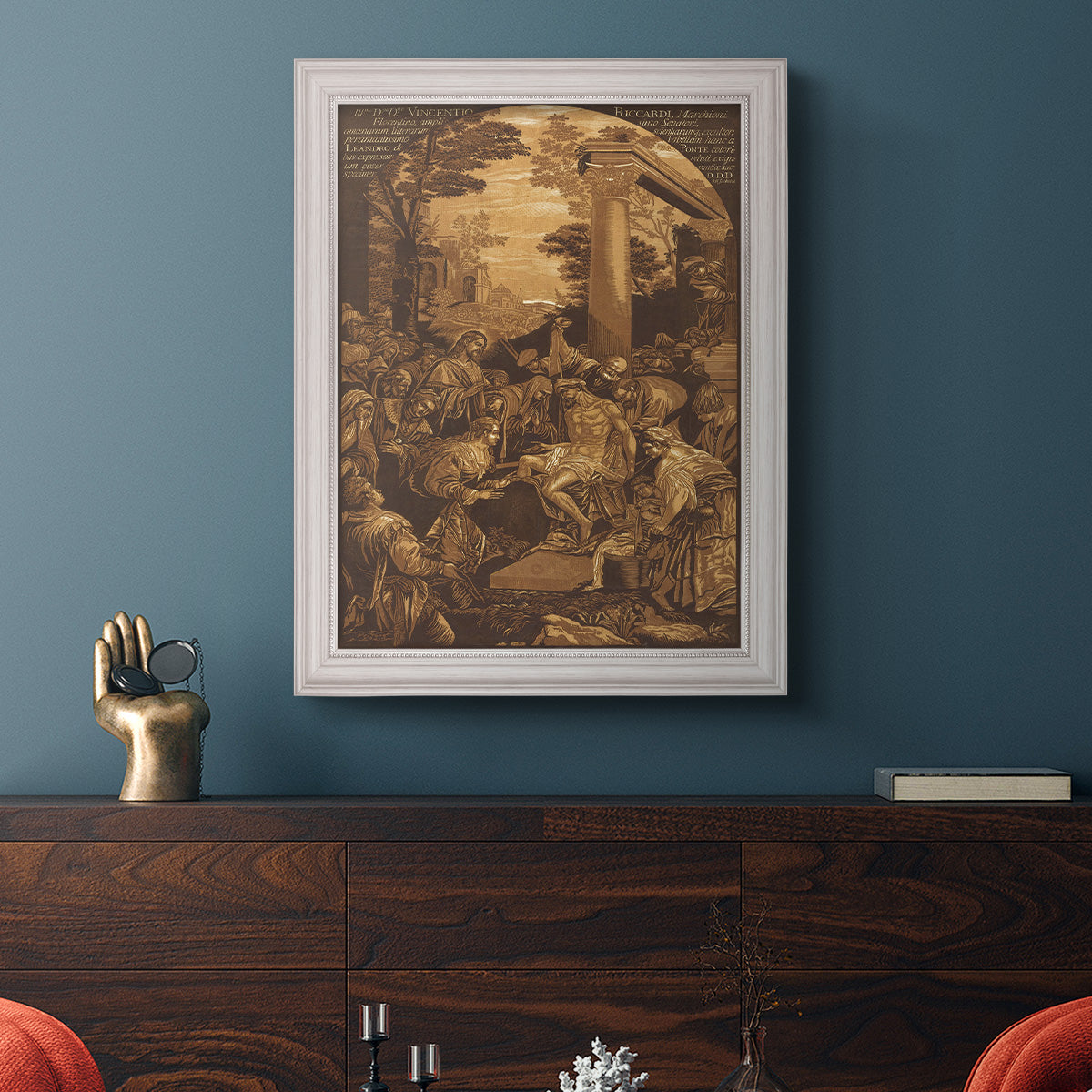 Monochrome religious painting of the raising of Lazarus by Leandro Bassano in an ornate weathered white frame displayed in a dark-toned interior setting.