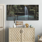 Three-panel canvas wall art featuring waterfall cascading through forest, displayed above a cabinet in an entryway.
