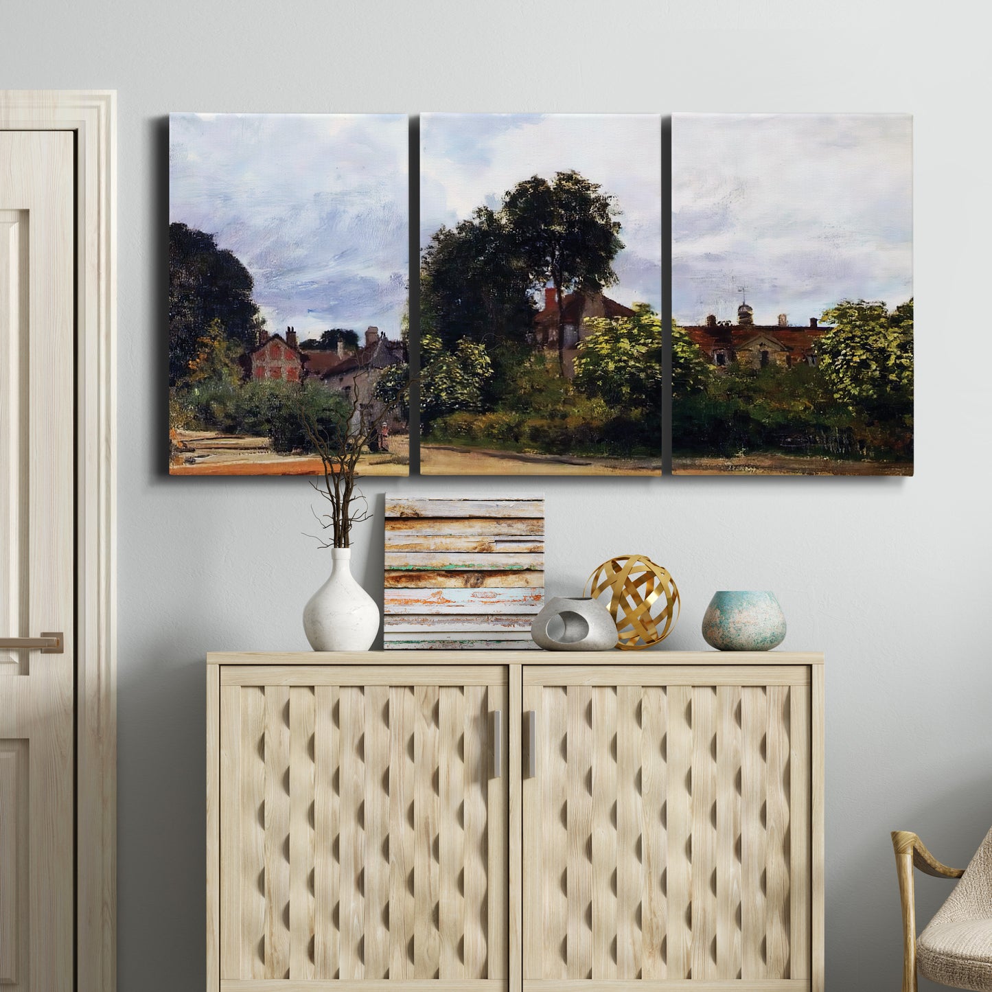Three-panel canvas wall art featuring garden corner with flowering trees, displayed above a cabinet in an entryway.