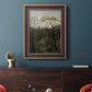 Dreamlike forest landscape scene by Henri Rousseau in an ornate bronzed mahogany wood frame displayed in a dark-toned interior setting.