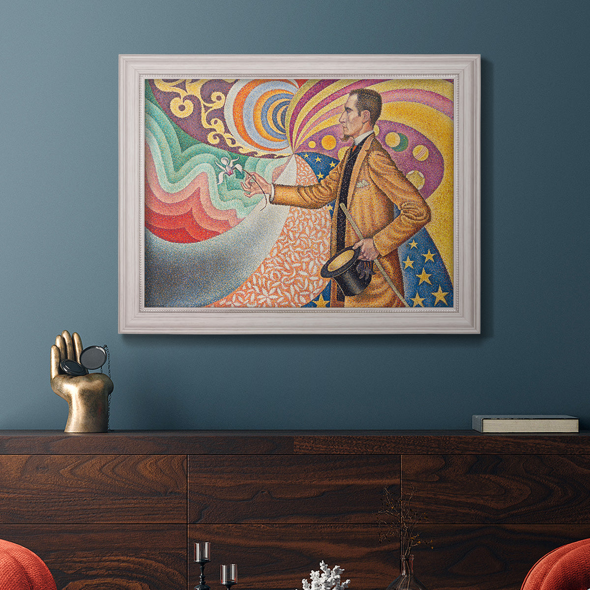 Neo-impressionist abstract portrait by Paul Signac in an ornate weathered white frame displayed in a dark-toned interior setting.