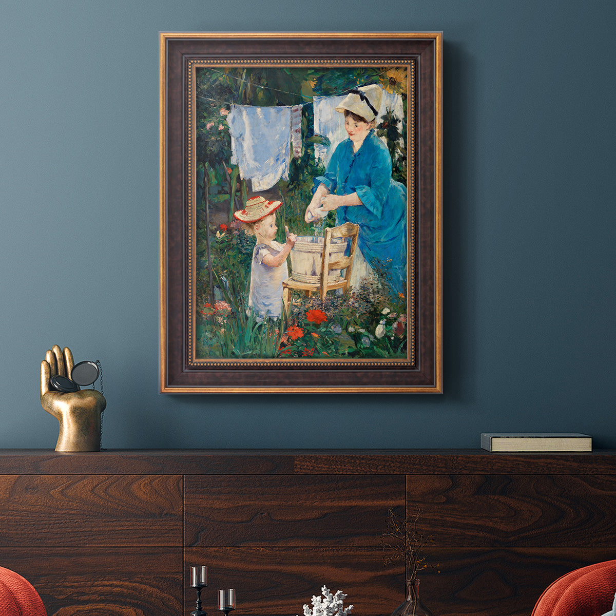 Intimate domestic genre scene by Édouard Manet in an ornate bronzed mahogany wood frame displayed in a dark-toned interior setting.