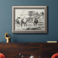 Classical rural landscape artwork by Nicolas Berchem in an ornate vintage silver frame displayed in a dark-toned interior setting.