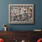 Contemporary dogwood blossom floral photography in an ornate vintage silver frame displayed in a dark-toned interior setting.