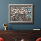 Modern spring dogwood flower photograph in an ornate vintage silver frame displayed in a dark-toned interior setting.