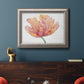 Modern minimalist pink floral artwork in an ornate vintage silver frame displayed in a dark-toned interior setting.