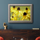 Modern floral Susan flower photography in an ornate vintage silver frame displayed in a dark-toned interior setting.