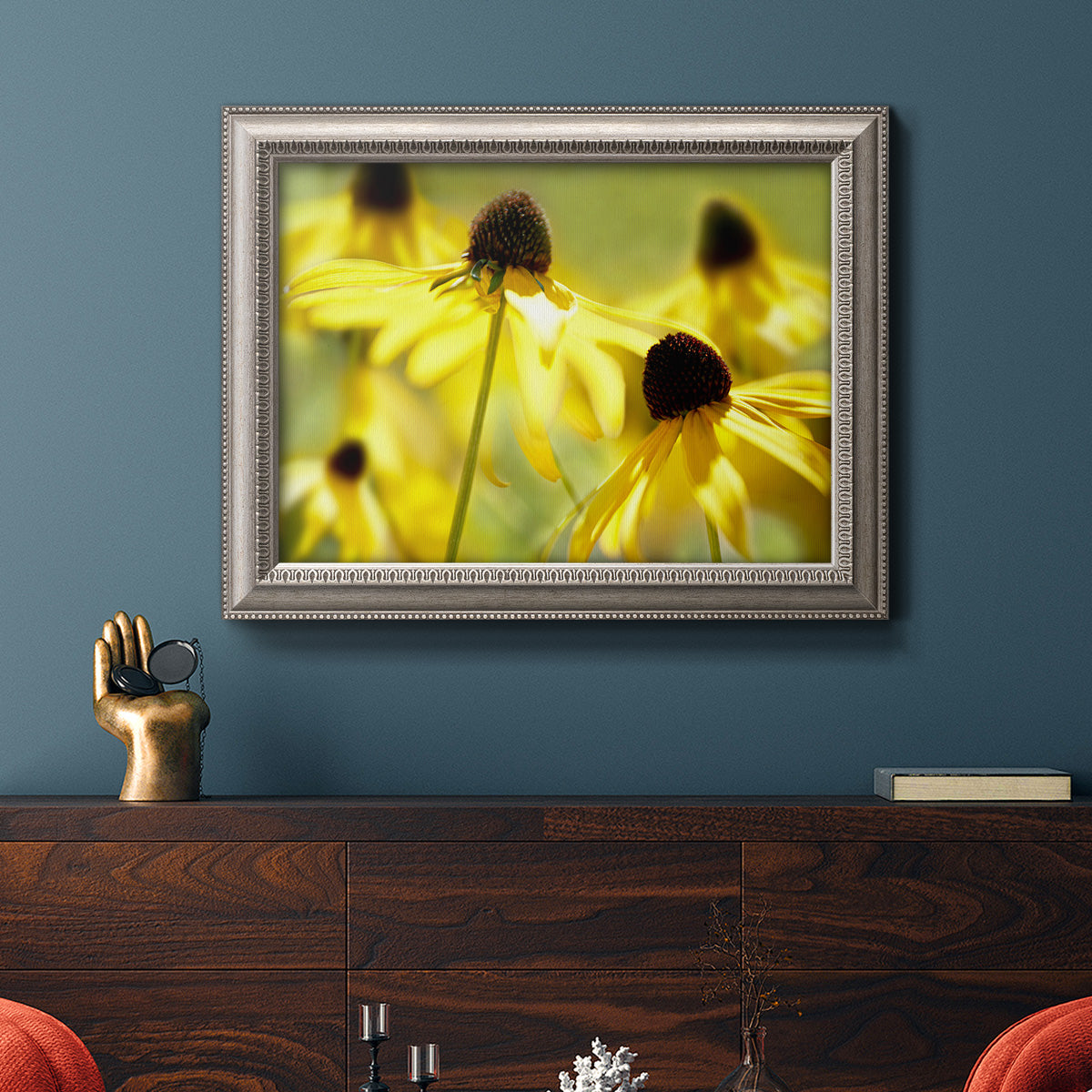 Modern floral Susan flower photography in an ornate vintage silver frame displayed in a dark-toned interior setting.