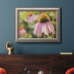 Echinacea flower botanical photography in an ornate vintage silver frame displayed in a dark-toned interior setting.