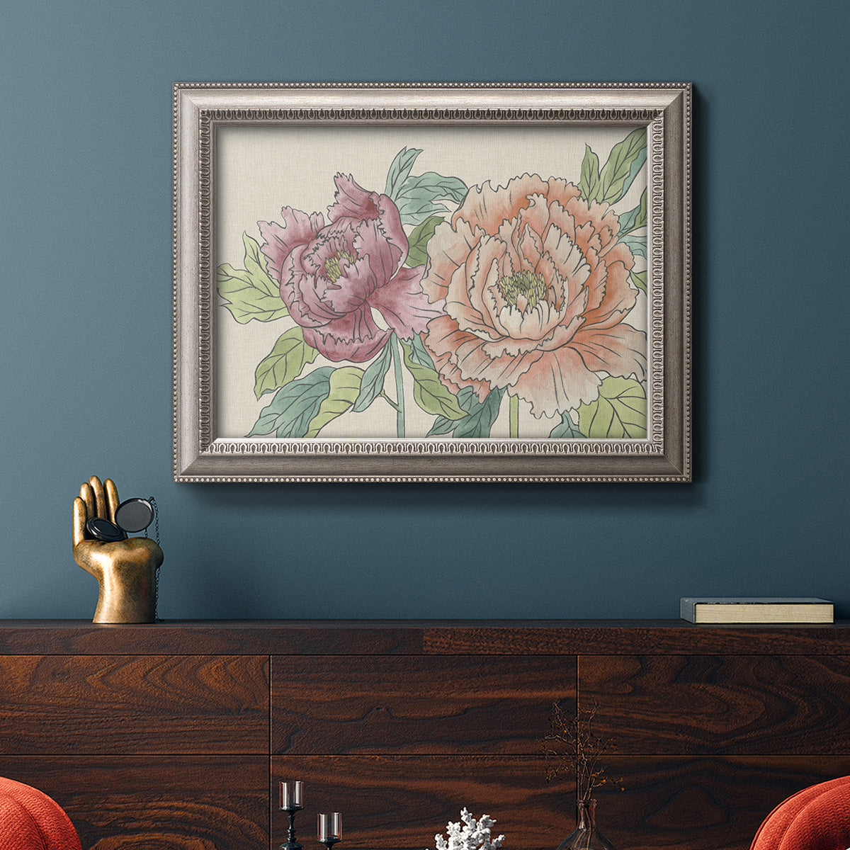 Modern peony floral drawing in an ornate vintage silver frame displayed in a dark-toned interior setting.