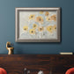 Minimalist poppy flower watercolor artwork in an ornate vintage silver frame displayed in a dark-toned interior setting.