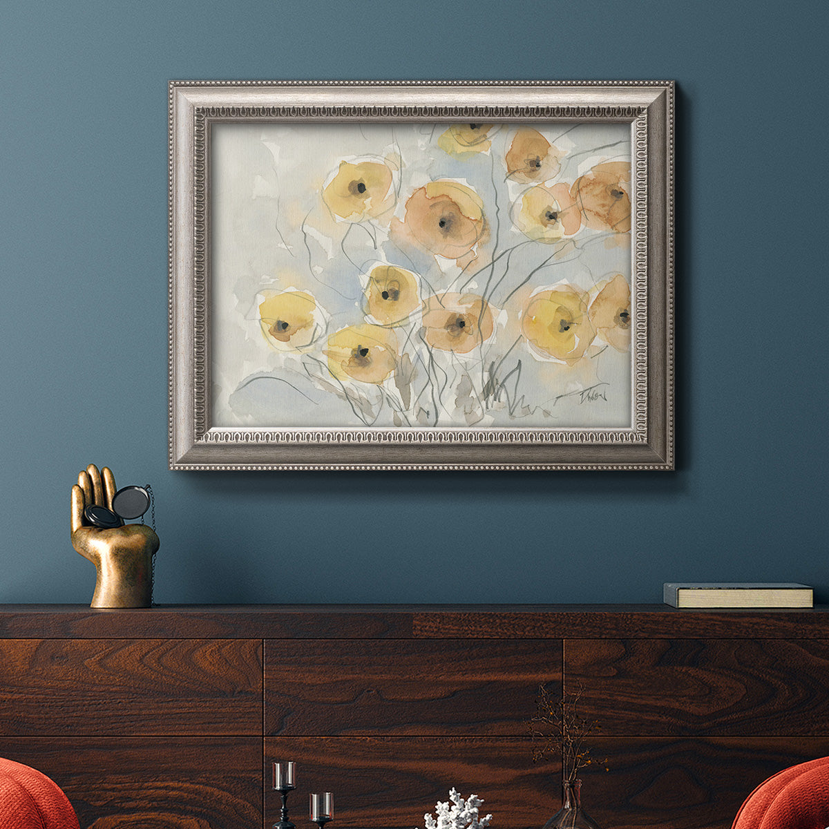 Minimalist poppy flower watercolor artwork in an ornate vintage silver frame displayed in a dark-toned interior setting.