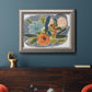 Bold modern botanical illustration in an ornate vintage silver frame displayed in a dark-toned interior setting.