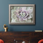 Soft abstract floral botanical photography in an ornate vintage silver frame displayed in a dark-toned interior setting.