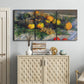 Three-panel canvas wall art featuring still life with pears and grapes, displayed above a cabinet in an entryway.