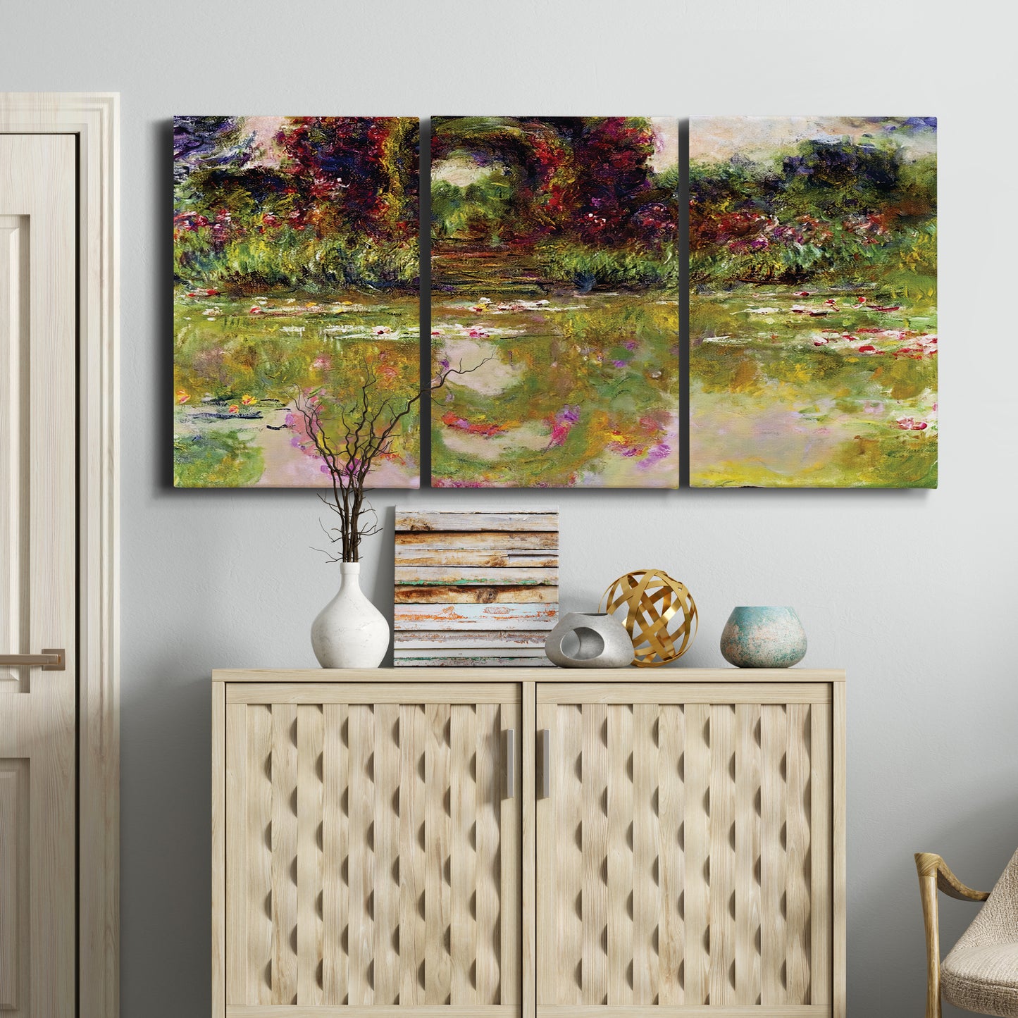 Three-panel canvas wall art featuring arched rose garden walkway, displayed above a cabinet in an entryway.