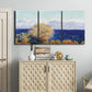Three-panel canvas wall art featuring mediterranean coastline with headland, displayed above a cabinet in an entryway.