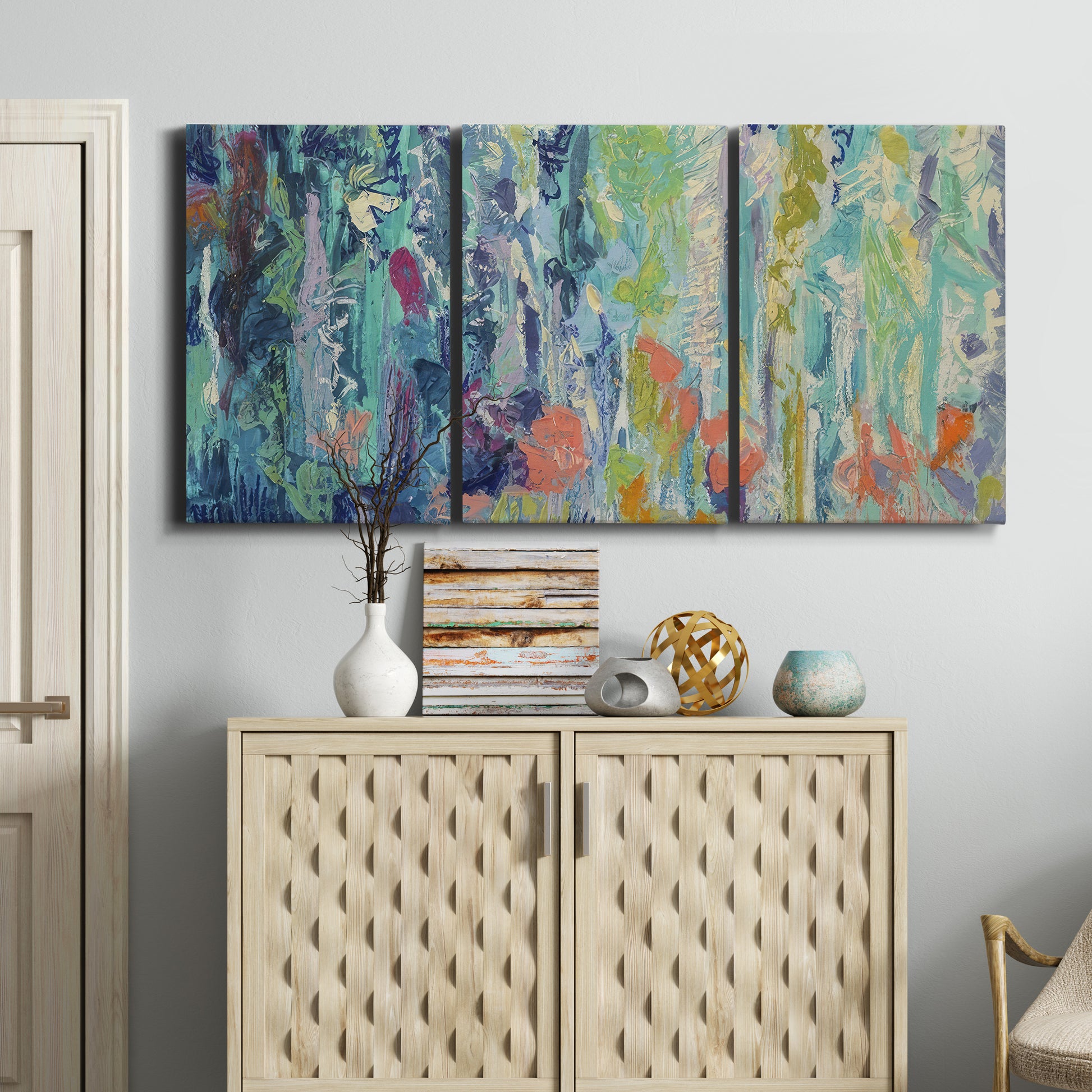 Three-panel canvas wall art featuring abstract rainfall with butterfly forms, displayed above a cabinet in an entryway.