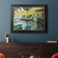 Impressionist riverside leisure scene by Claude Monet in an ornate black frame with gilded inner detail displayed in a dark-toned interior setting.