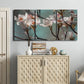 Three-panel canvas wall art featuring dogwood blossoms in spring photograph, displayed above a cabinet in an entryway.