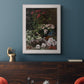 Early impressionist floral painting by Claude Monet in an ornate weathered white frame displayed in a dark-toned interior setting.