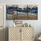Three-panel canvas wall art featuring abstract coastal jewel toned composition, displayed above a cabinet in an entryway.