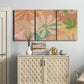 Three-panel canvas wall art featuring neutral toned botanical floral silhouettes, displayed above a cabinet in an entryway.