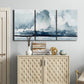 Three-panel canvas wall art featuring abstract rainstorm watercolor, displayed above a cabinet in an entryway.