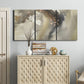 Three-panel canvas wall art featuring flowing abstract wave motion, displayed above a cabinet in an entryway.
