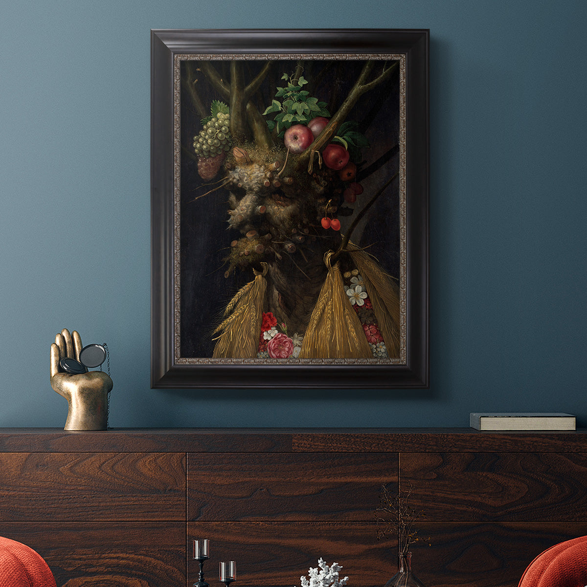 Surreal allegorical portrait representing the four seasons by Giuseppe Arcimboldo in an ornate black frame with gilded inner detail displayed in a dark-toned interior setting.