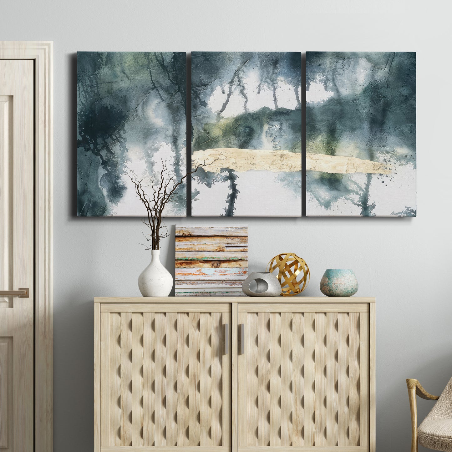 Three-panel canvas wall art featuring saturated abstract color fields, displayed above a cabinet in an entryway.