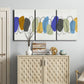 Three-panel canvas wall art featuring minimalist geometric abstract spacing, displayed above a cabinet in an entryway.