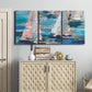 Three-panel canvas wall art featuring graphic pop style sailboats, displayed above a cabinet in an entryway.