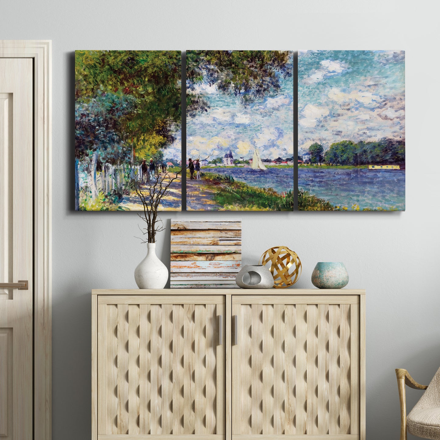 Three-panel canvas wall art featuring river landscape with boats, displayed above a cabinet in an entryway.