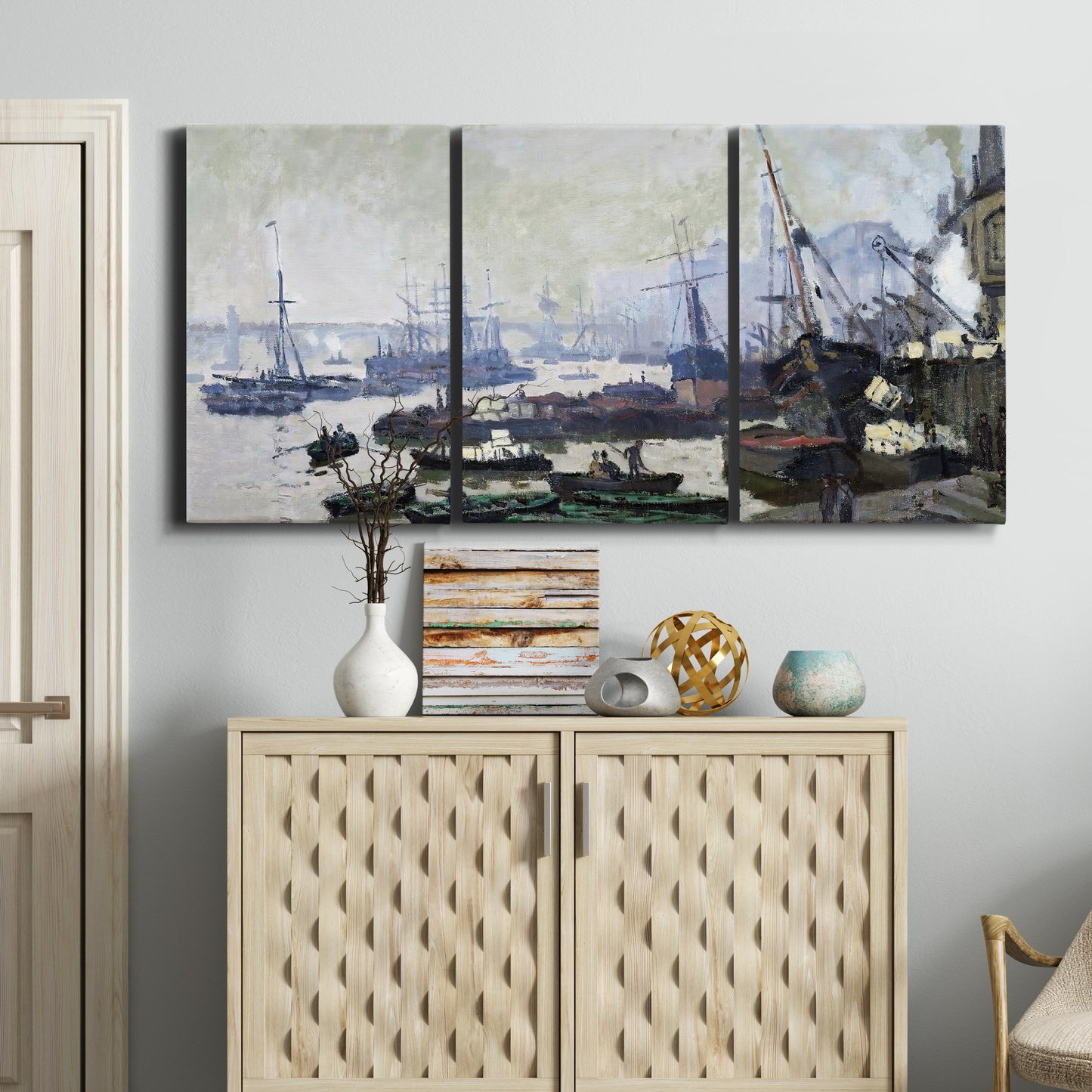 Three-panel canvas wall art featuring working harbor with docked boats, displayed above a cabinet in an entryway.