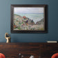 Impressionist coastal watch cabin scene by Claude Monet in an ornate black frame with gilded inner detail displayed in a dark-toned interior setting.