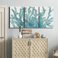 Three-panel canvas wall art featuring blue coral inspired watercolor, displayed above a cabinet in an entryway.