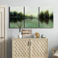 Three-panel canvas wall art featuring rain soaked landscape at sunset, displayed above a cabinet in an entryway.