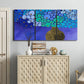 Three-panel canvas wall art featuring blue poppy floral abstraction, displayed above a cabinet in an entryway.